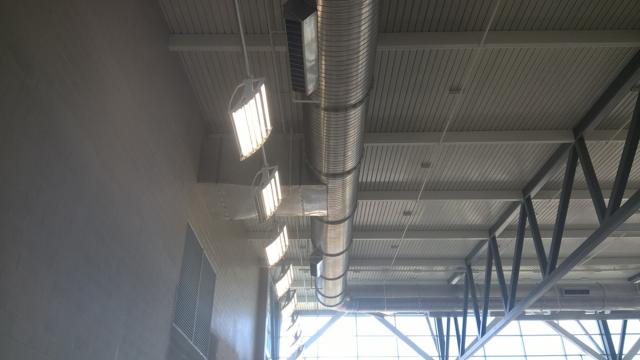 Spiral duct under roof trusses